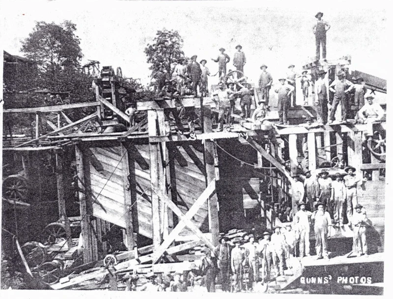 Workers standing on timber scaffolding at the McCormick iron mines in 1906