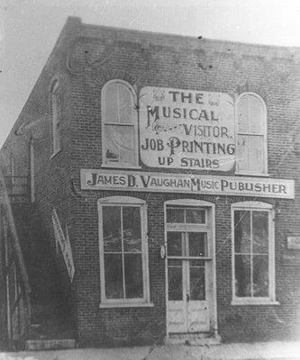 Historic photograph of the James D. Vaughan music publishing building on the square